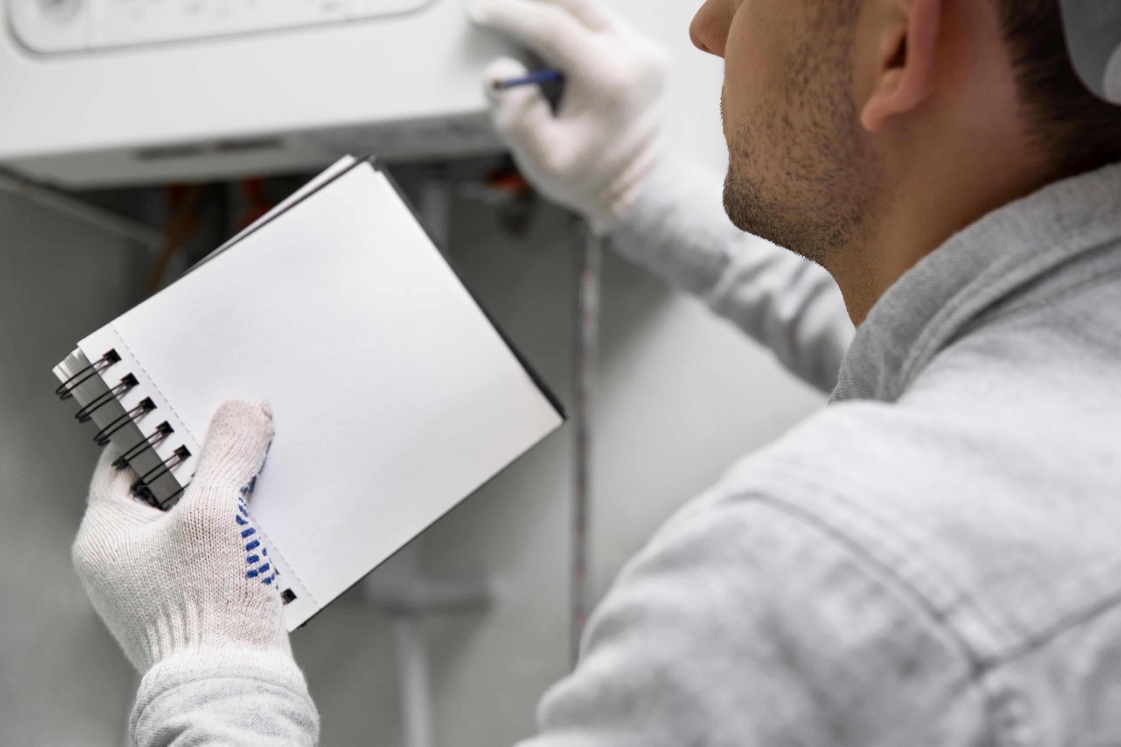 worker-repairing-water-heater